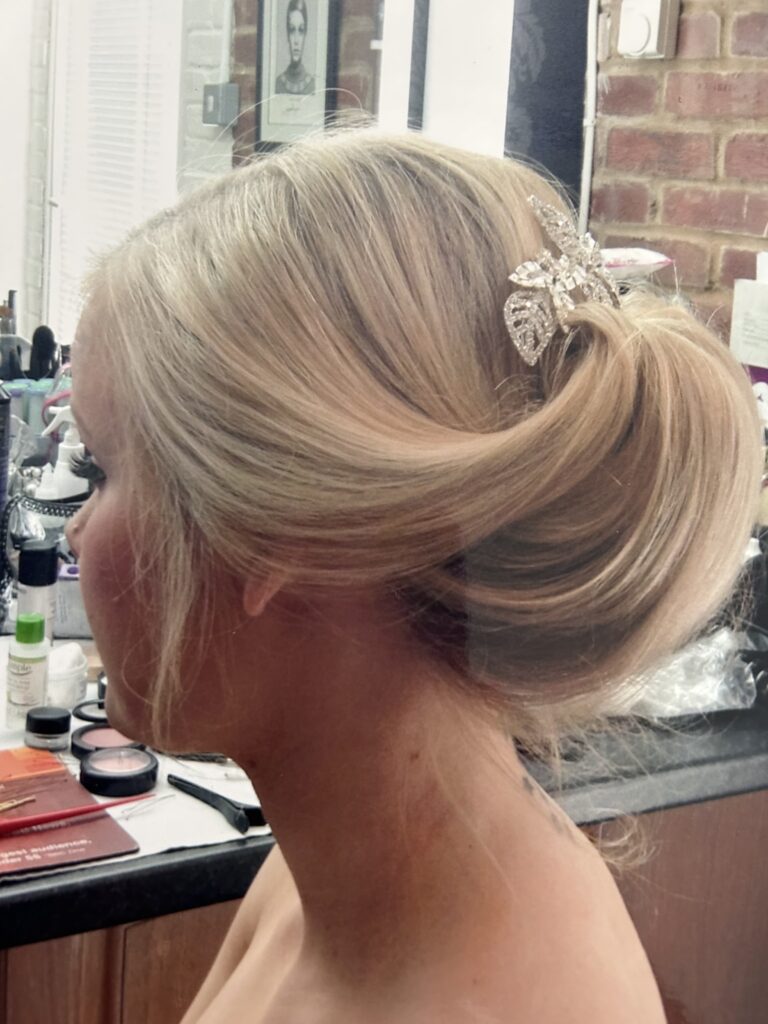 Soft up swept hair with Swarovski fascinator holding it all in place 
