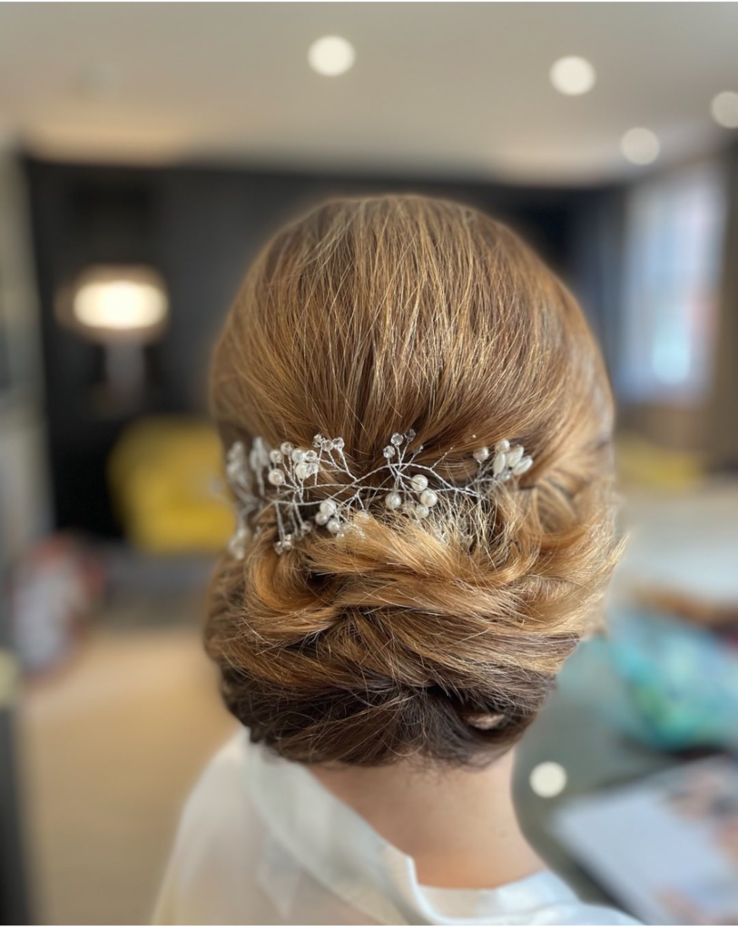 wedding trend. Simple fascinator holding back and enhancing a beautiful hair style created by Anabela a Berkshire wedding hair and makeup artist